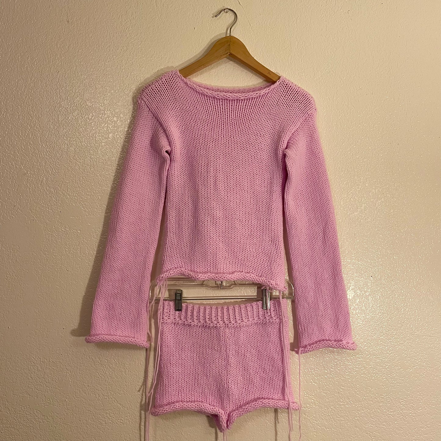 Light pink knitted long sleeve top with matching booty shorts